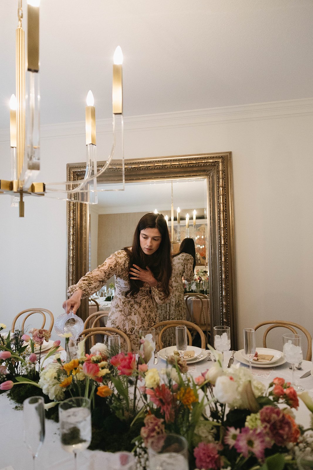 A final pour before guests arrive, framed by the garden table