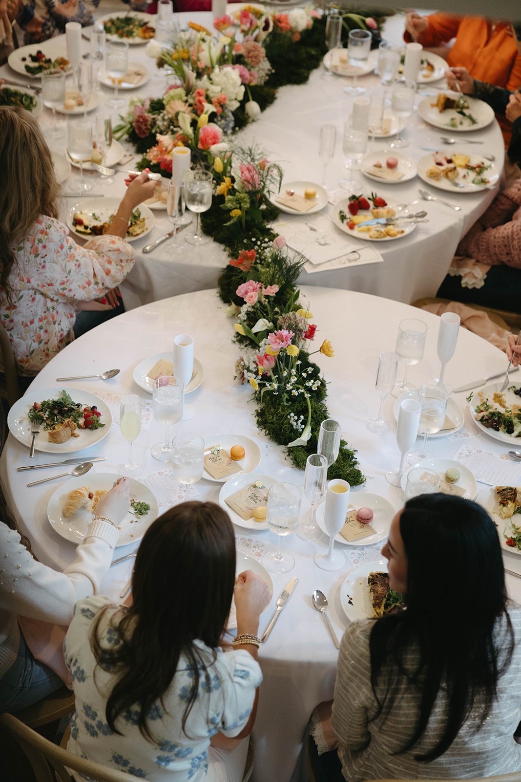 Guests dining around the garden runner at the shower